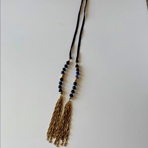 Necklace from anthropology.  60 inches long total including tassels. Dark blue